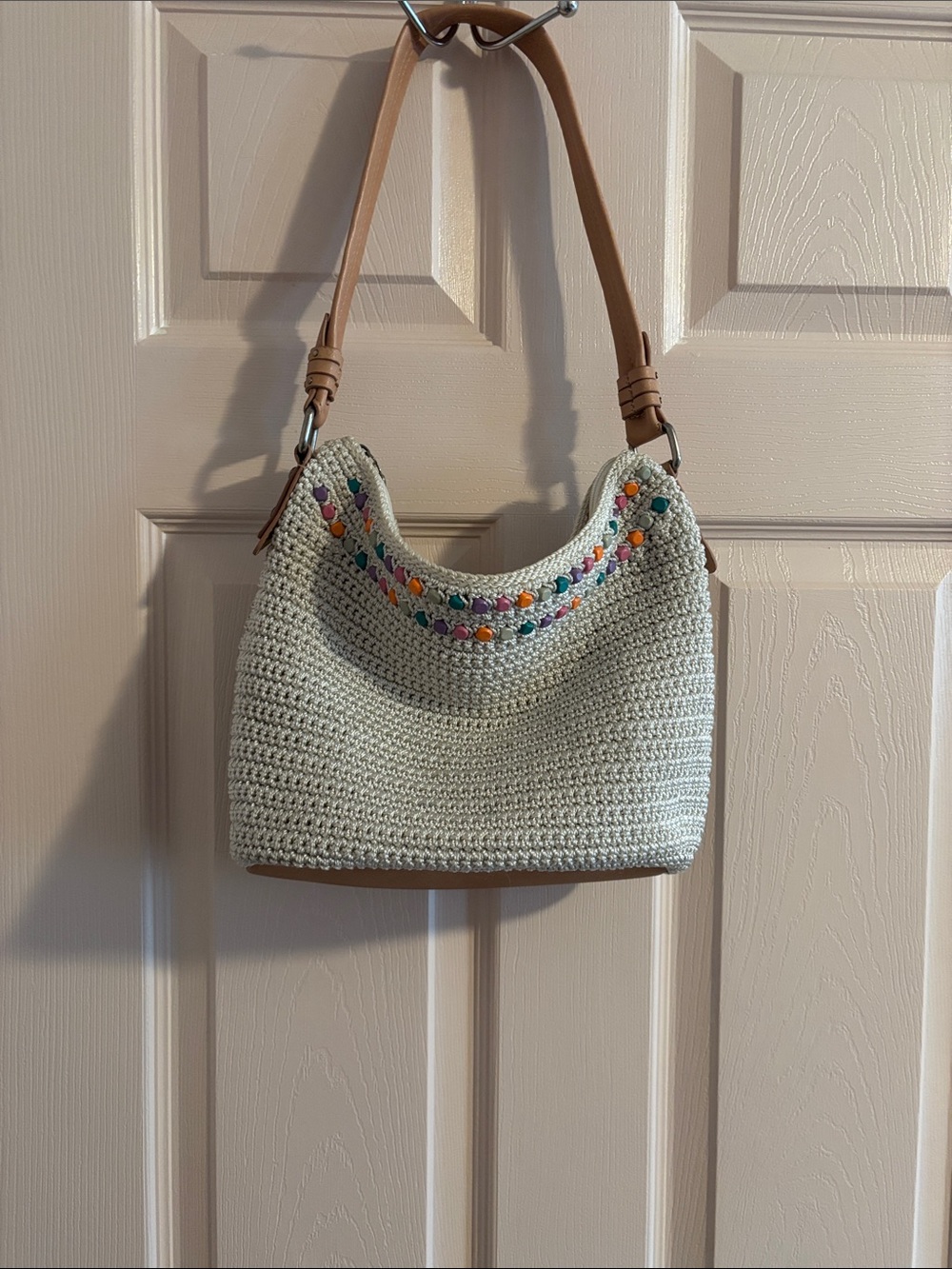The Sak Cream Crochet Shoulder Bag with Multicolor Embroidery and Tan Strap